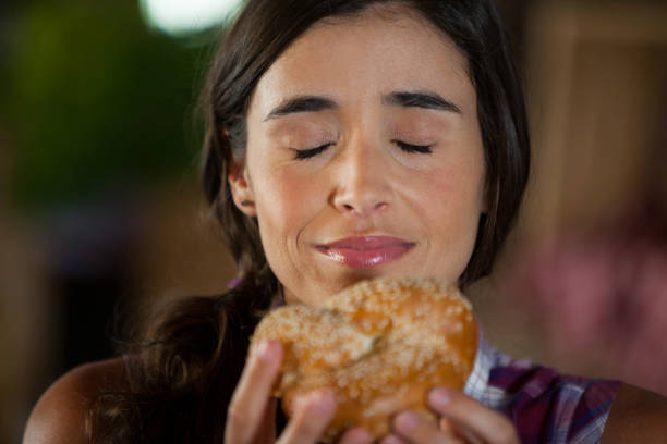 Woman smelling bread
