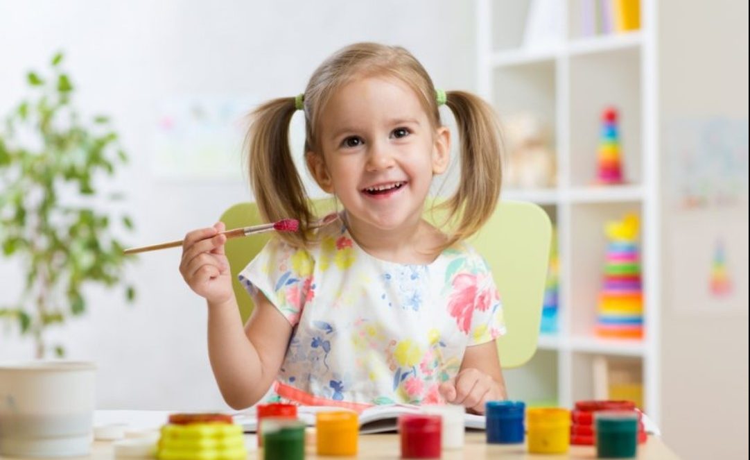 child playing with art