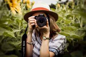 photography; a lady taking photographs with camera