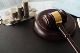 gavel judge with coin money and book bank accounts. -disciplined saving