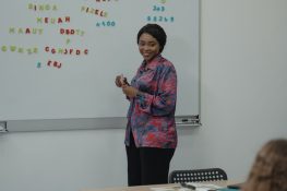 a teacher teaching a second language