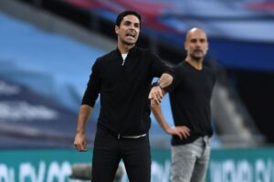 Mikel Arteta and Pep Guardiola on the touchline coaching their teams