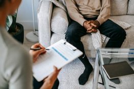 client in a therapy session discussing-problems-with-anonymous-psychologist-