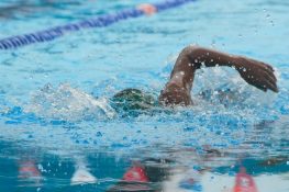 A man swimming to keep their body healthy