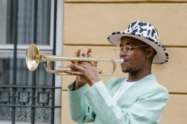 man-in-suit-playing-trumpet-